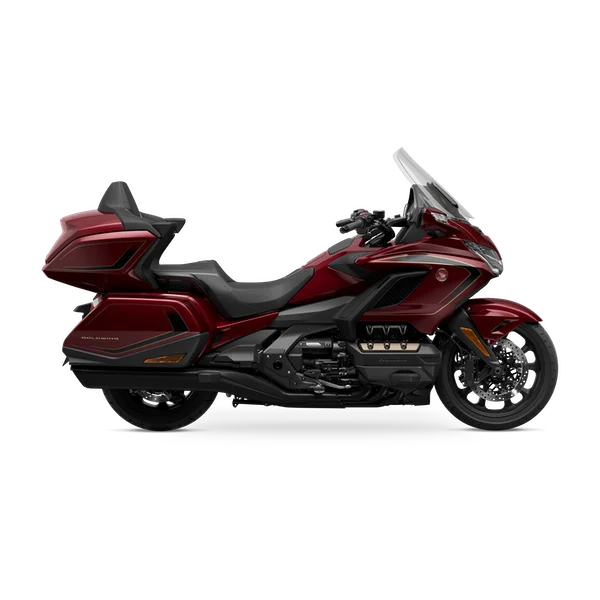 Honda Gold Wing Tour Premium in Bordeaux Red Metallic with integrated top box and panniers, studio side profile
