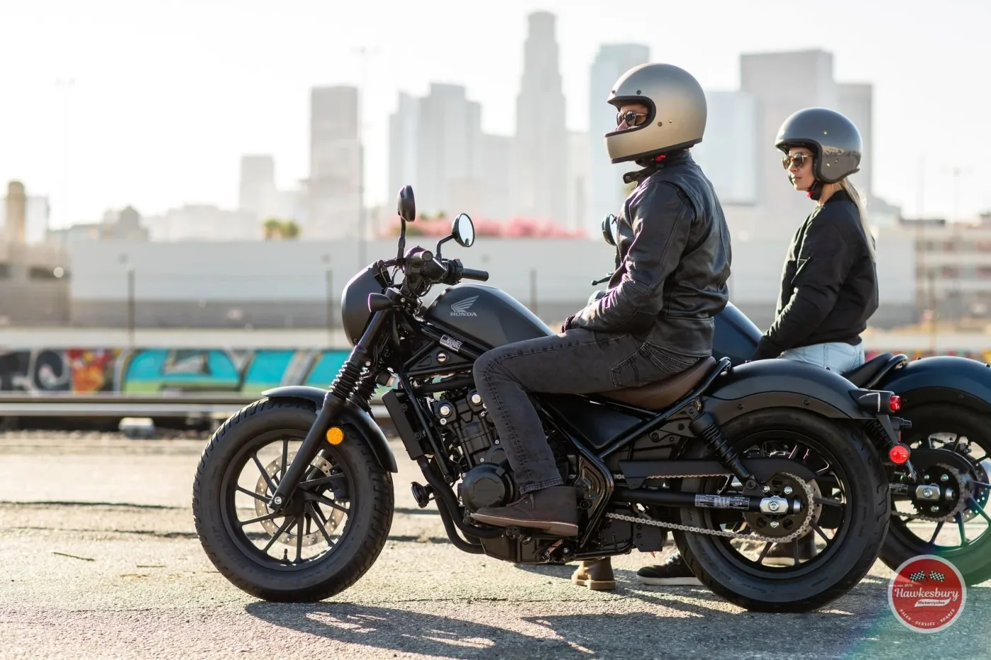 Honda CMX500 Rebel cruiser in blacked-out bobber styling with wide tyres, side profile