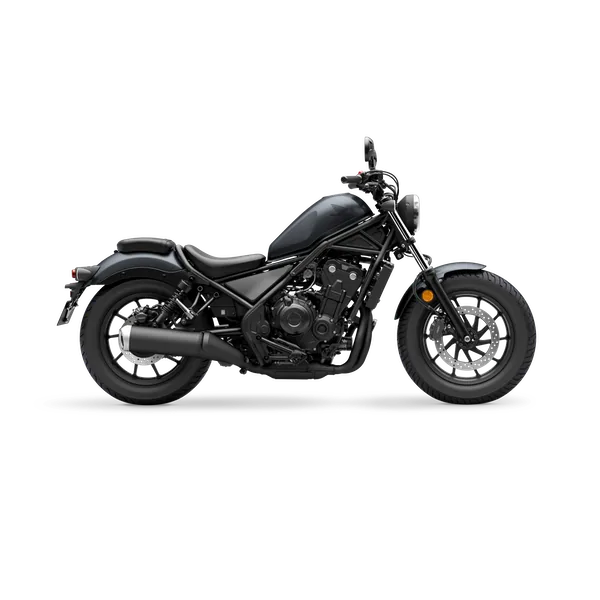 Honda Rebel cruiser in matte dark grey with blacked-out engine, forks and exhaust, studio side view