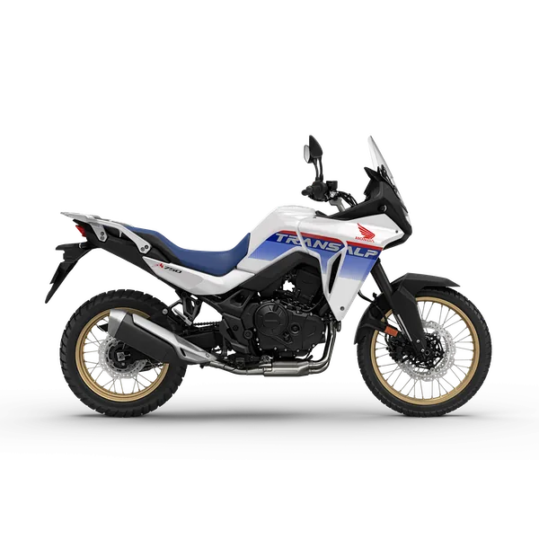 White Honda XL750 Transalp adventure motorcycle with blue and red accents, gold forks and a tall screen, studio side view