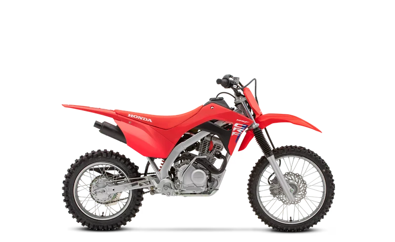 Red Honda CRF125F, studio side view on a white background
