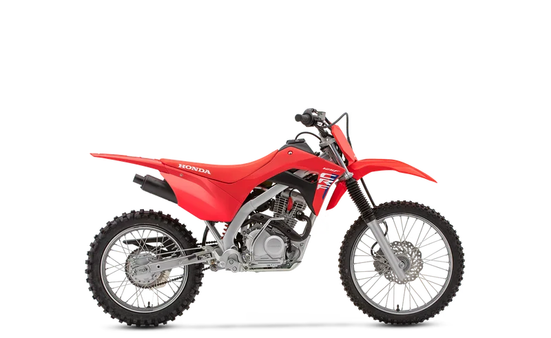 Red Honda CRF125FB Big Wheel, studio side view showing its larger front wheel