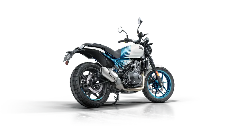 Royal Enfield Guerrilla 450 roadster in Brava Blue and white, rear three-quarter view