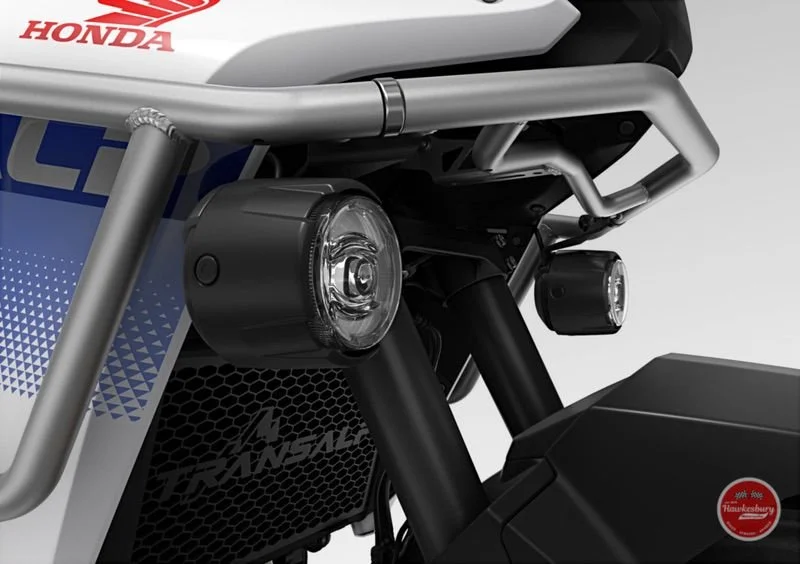 Honda motorcycle front section showing headlights and black suspension forks