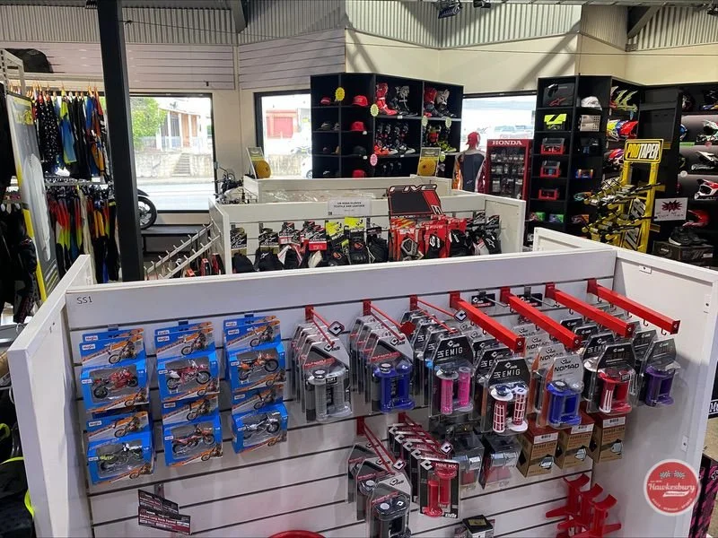 Grips, levers and accessories on display racks inside the store