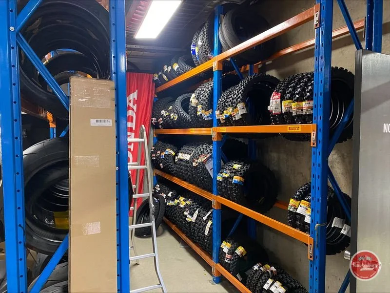 Racks of road and off-road tyres in the warehouse