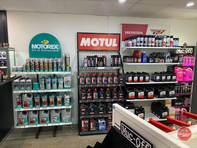 Shelves of Motorex, Motul and Honda oils and additives