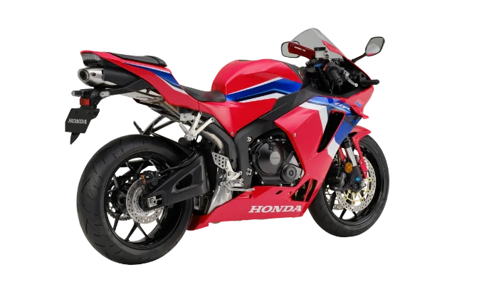 Honda CBR600RR supersport motorcycle in red, white and blue with winglets, studio side profile